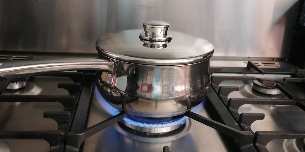 Pan with lid on a gas hob