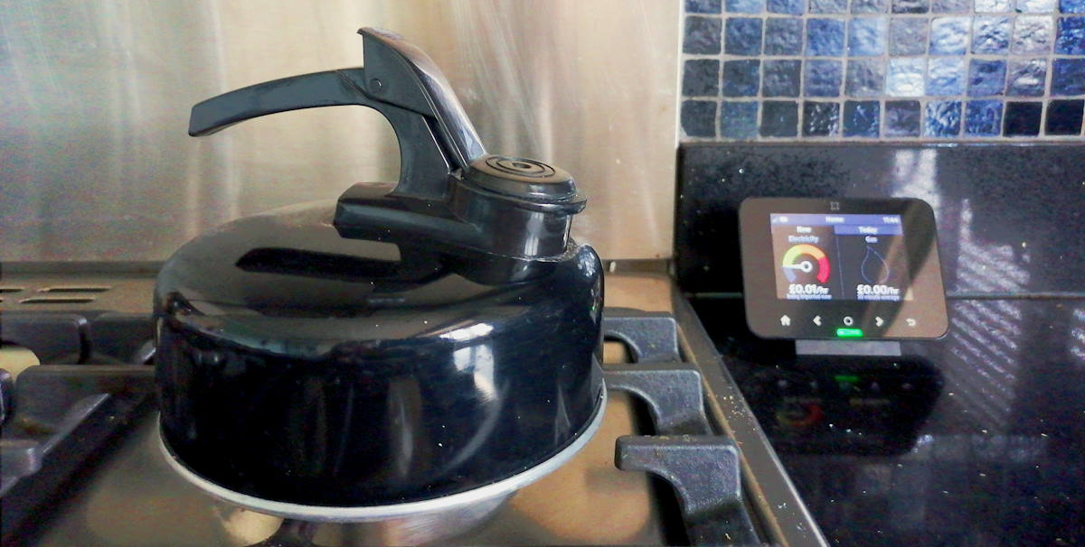 Gas hob kettle in a kitchen with energy monitor